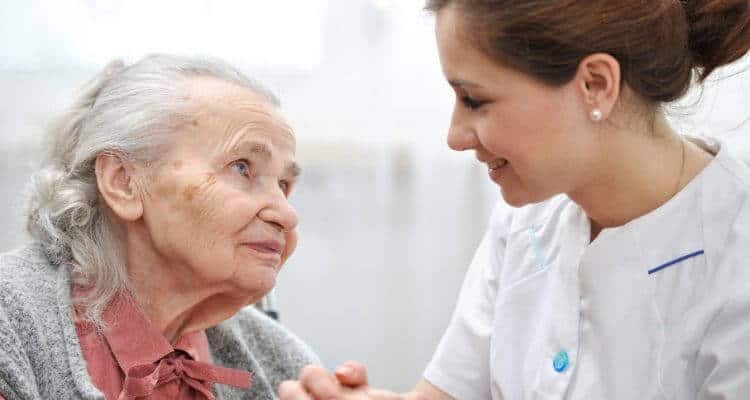 a home health nurse caring for a patient