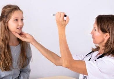 nurse checking patients eye