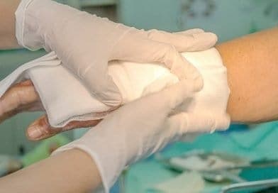 a burn care nurse changing a wound dressing