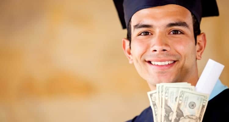 a nursing school grad holding money