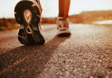 a nurse walking in Brooks tennis shoes