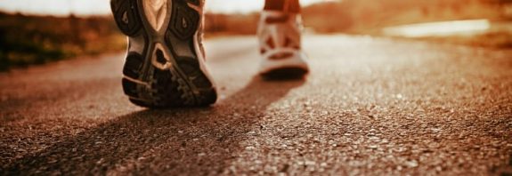 a nurse walking in Brooks tennis shoes