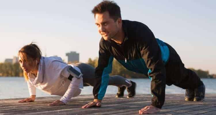 two nurses doing push ups