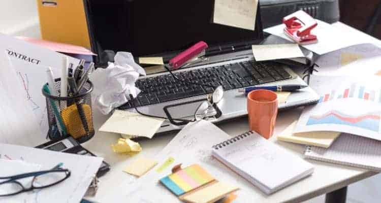 a cluttered nursing student study desk