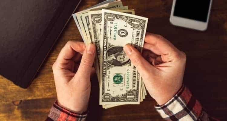 a nurse holding cash