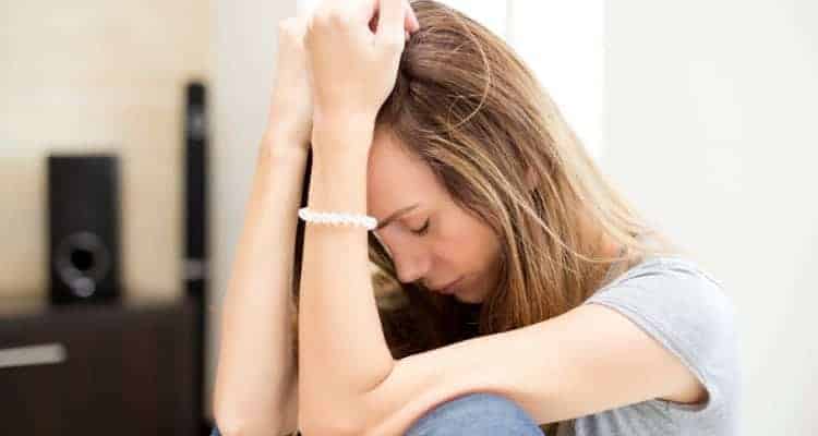 a woman sad about failing the NCLEX