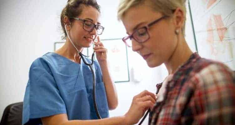 a nurse assessing a patient