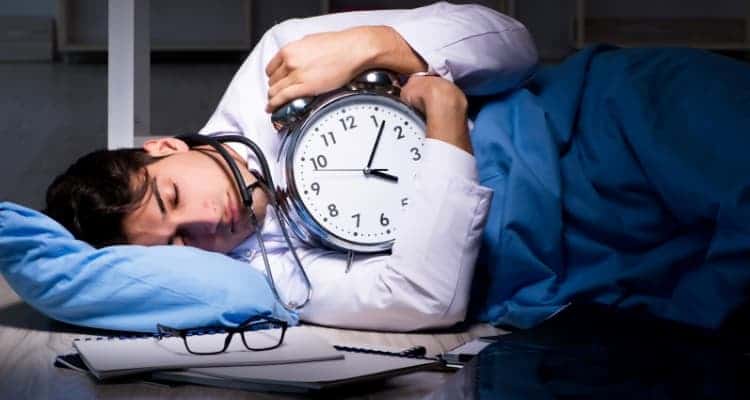 a healthcare worker sleeping during their shift