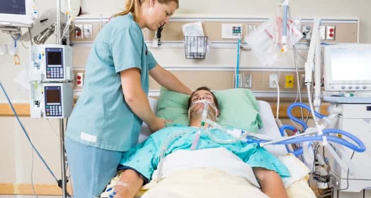 icu nurse taking care of patient