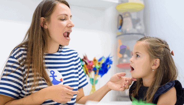 speech pathologist working with pediatric patient