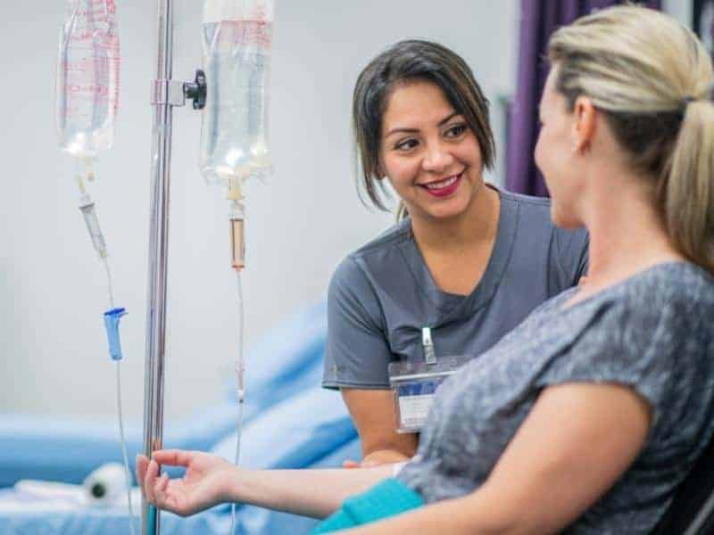 a nurse and a patient talking