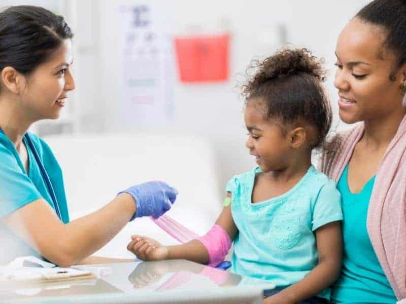 a healthcare worker with kid and mom