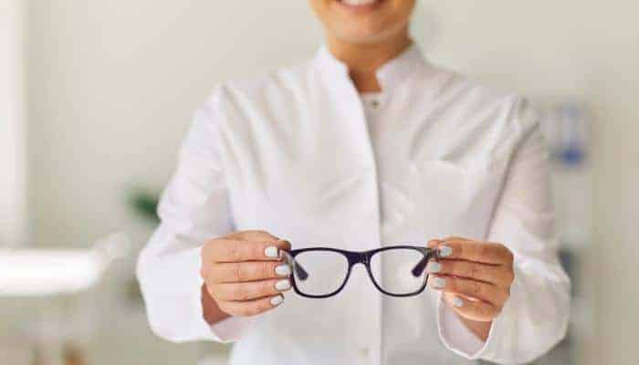 giving a patient glasses