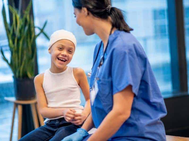 nurse and patient smiling