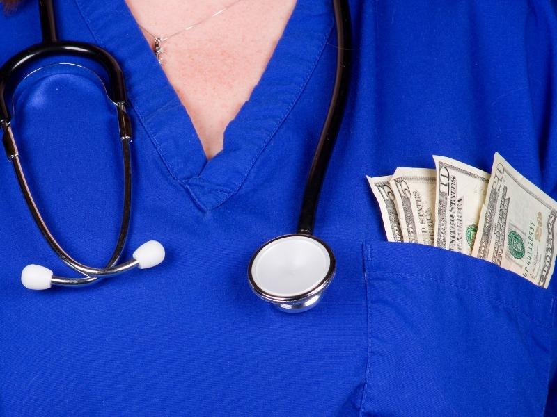 Nurse with money in pocket