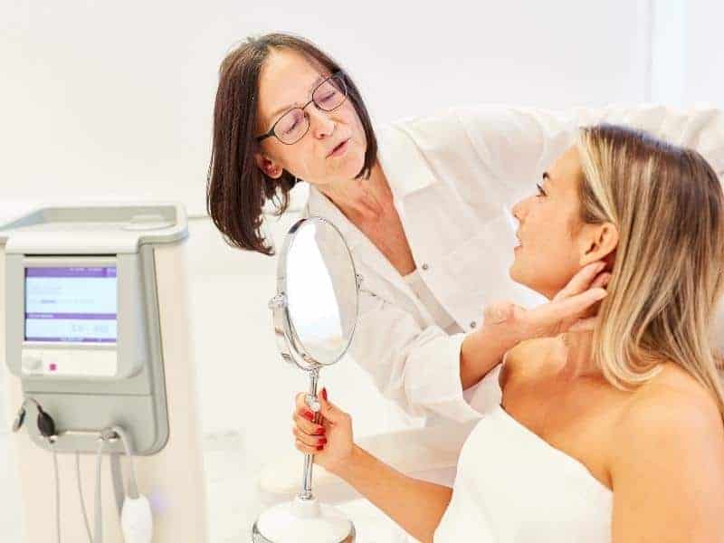 dermatologist examines a patients skin