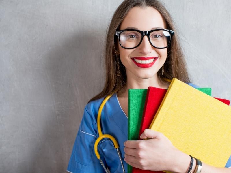 nurse carrying books