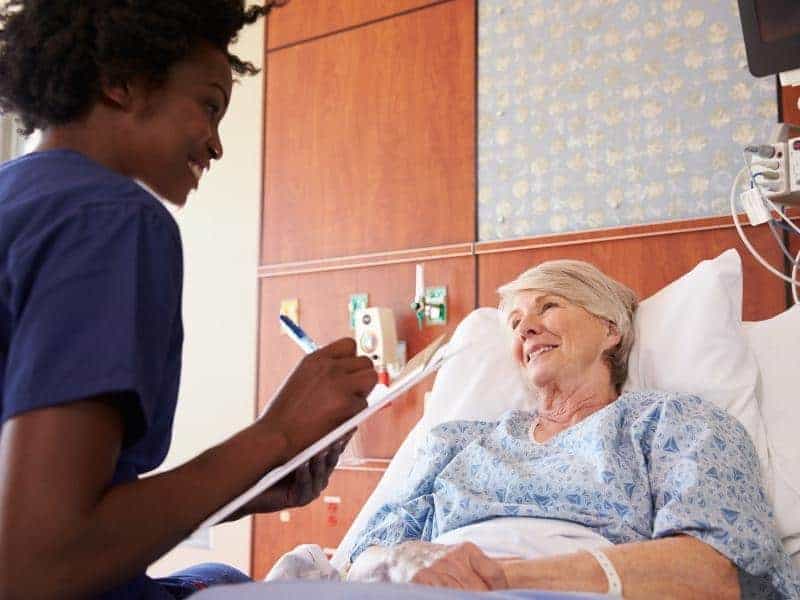 nurse talking to female patient