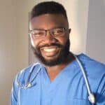 portrait of thomas wearing scrubs with stethoscope