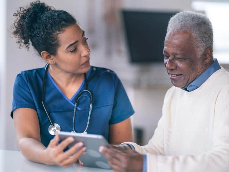 a nurse talking to patient