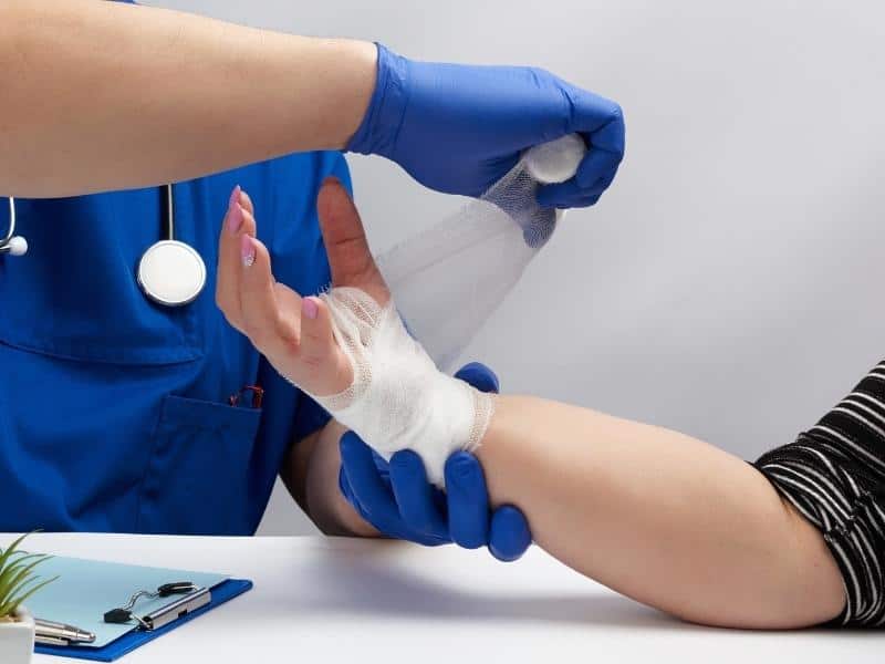 nurse treating injury