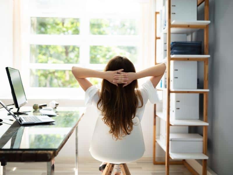 woman sitting beside workstation