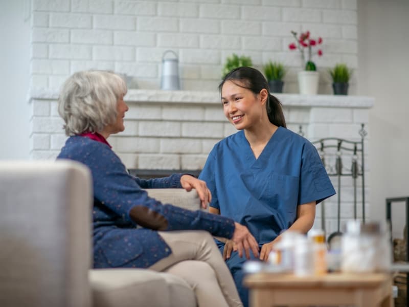 nurse talking to old woman