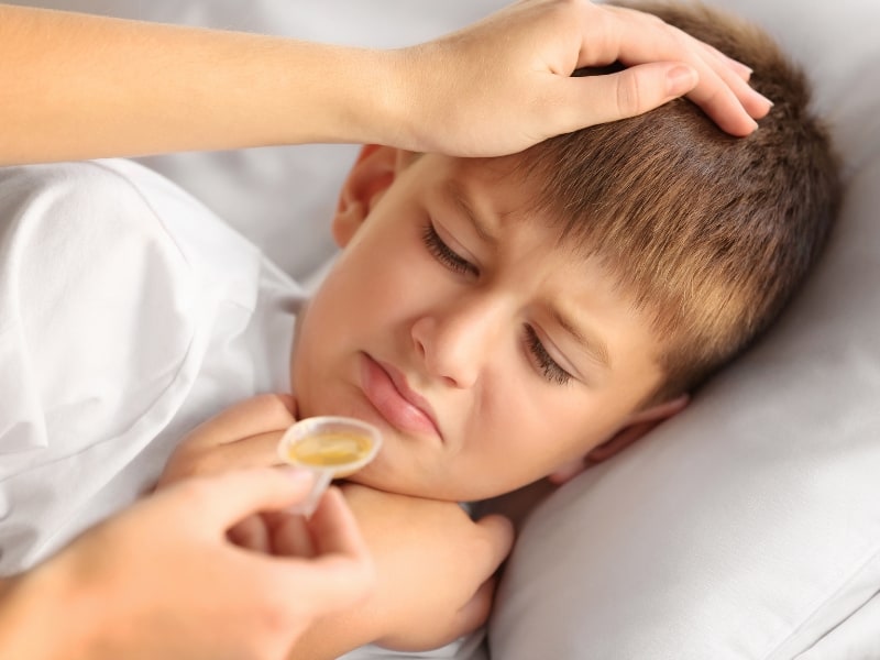 child taking medication