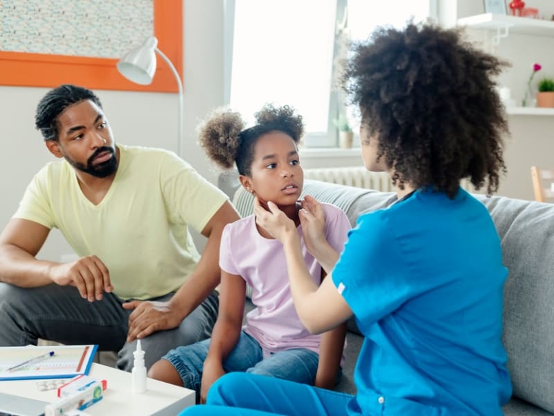 kid facing nurse for check up