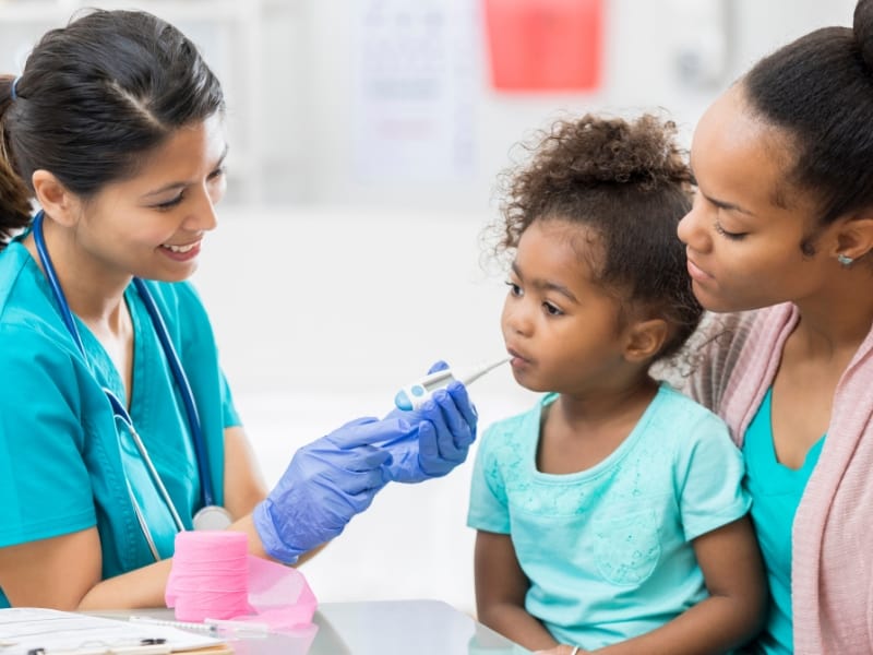 pediatric nurse checking kid