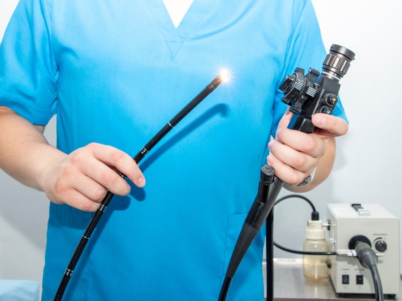 scrubs holding endoscope