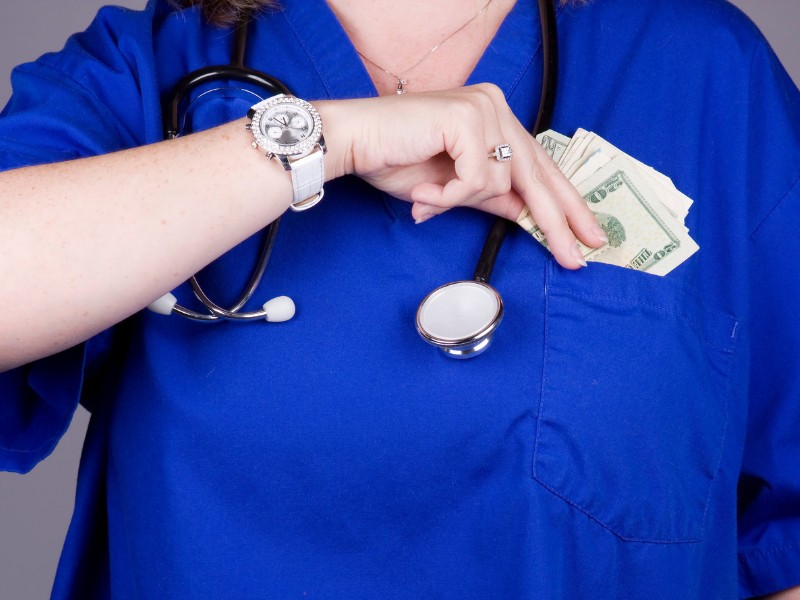 dollar on nurse's pocket