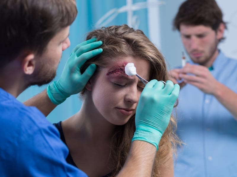 nurse treating wound